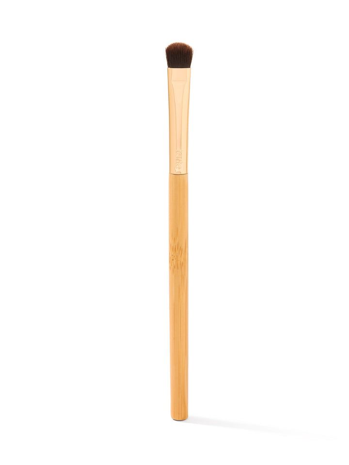 Makeup brush with wooden handle and brown bristle head on a white background