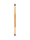Makeup brush with wooden handle and black bristles on a white background