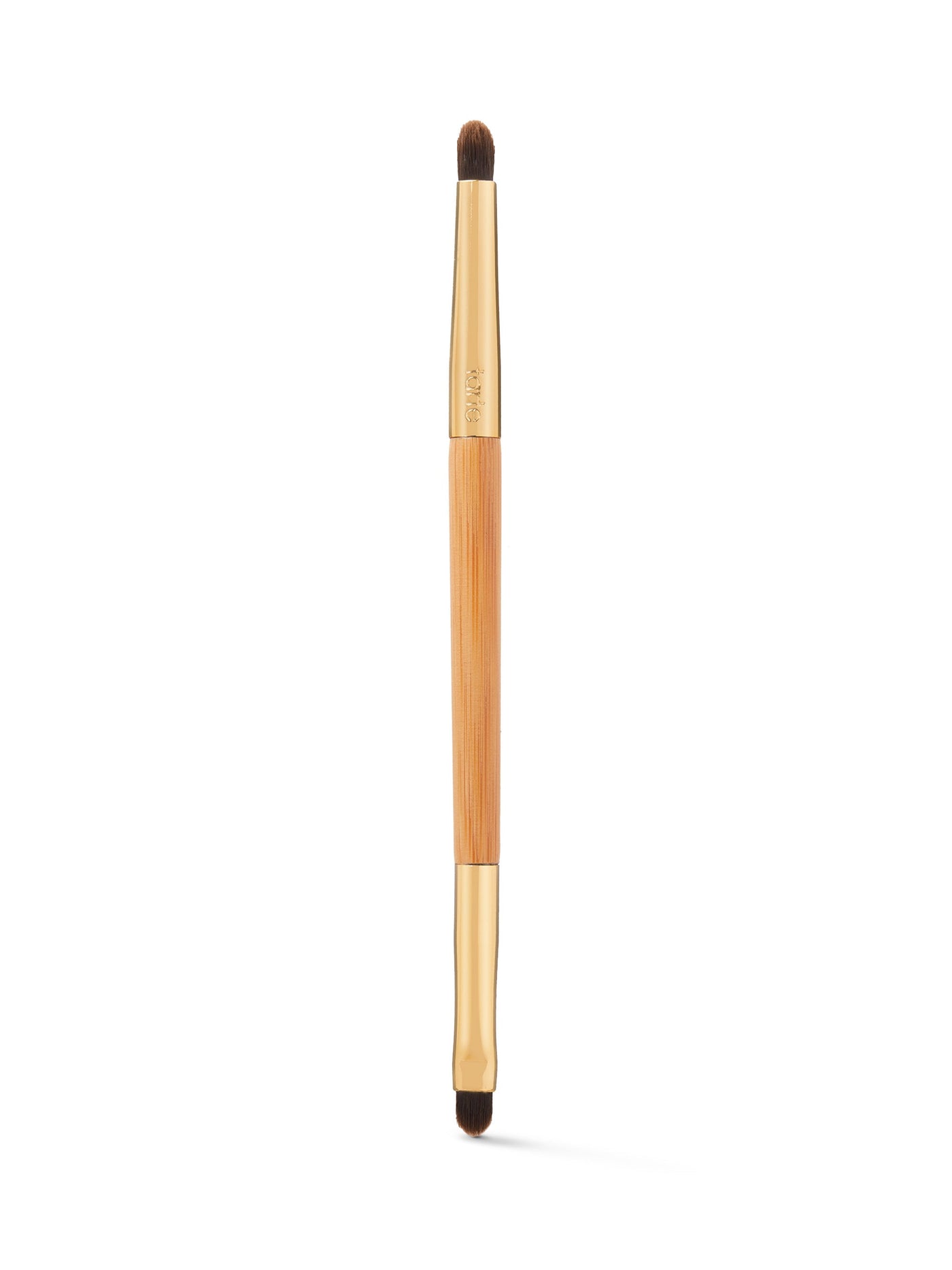 Makeup brush with wooden handle and black bristles on a white background