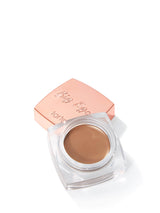 Tarte Big Ego cream eyeshadow in rose gold case on white background