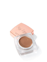 Tarte Big Ego brow product with rose gold case on white background