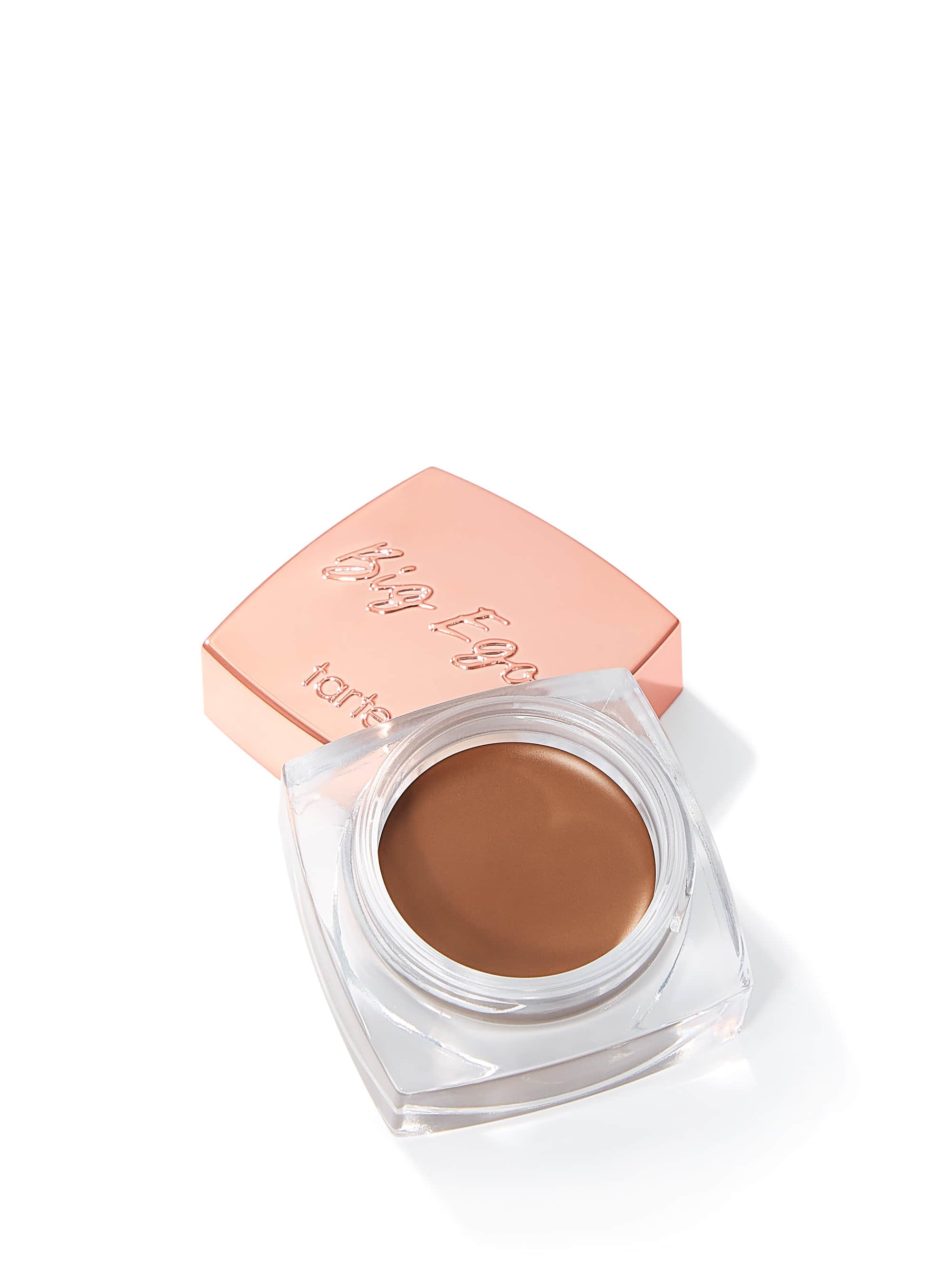 Tarte Big Ego cream eyeshadow in a rose gold container on a white background