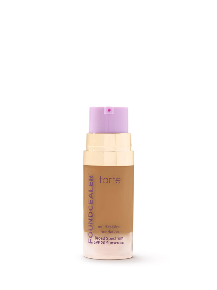 Tarte multi-benefit foundation bottle with purple cap on a white background