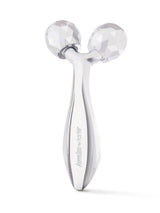Silver facial roller with brand name on a white background