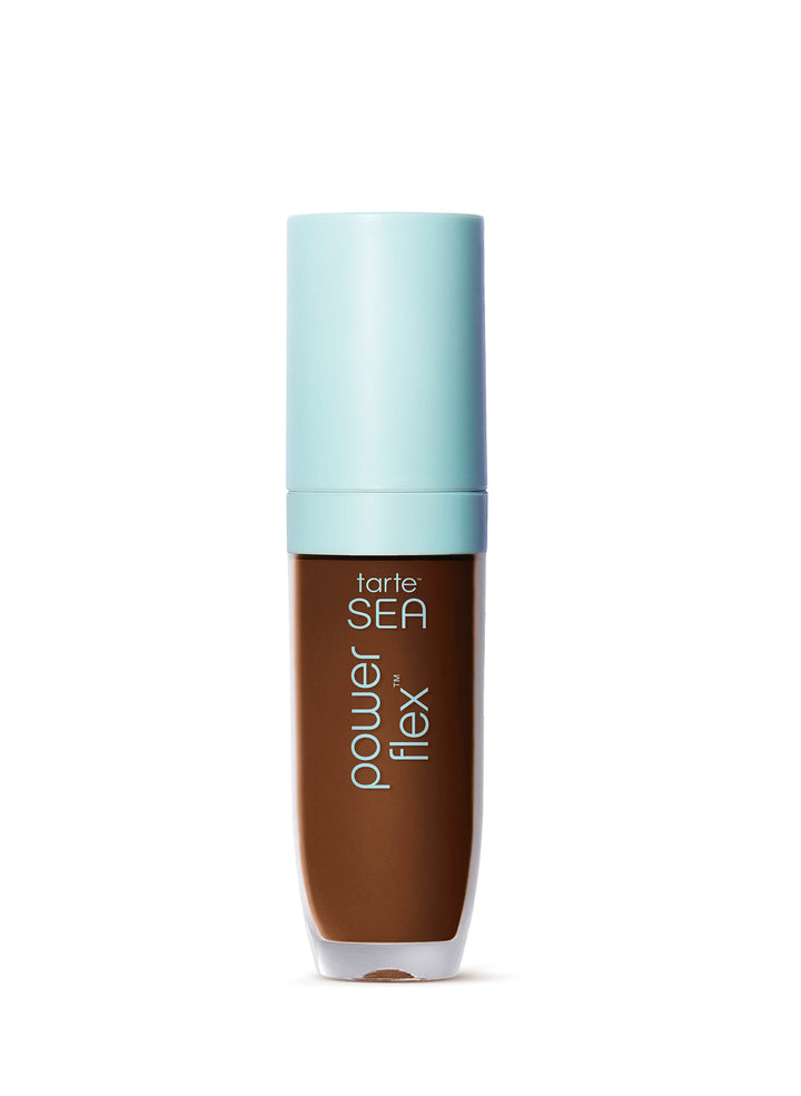 Small glass Tarte serum bottle containing brown liquid, standing upright with a pale turquoise cap on a plain white background. Text on bottle: tarte.
