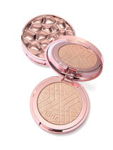 Compact powder with rose gold casing on a white background