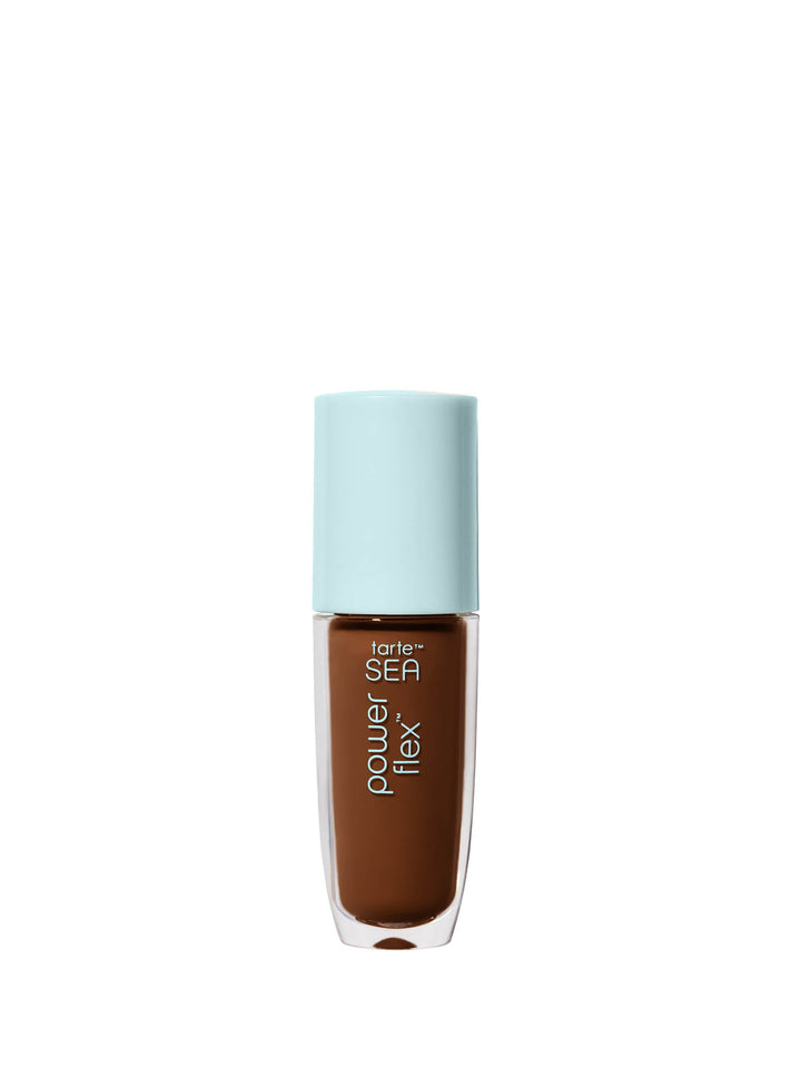 Travel-size tarte concealer bottle with a blue cap and brown liquid visible through the clear portion of the bottle.