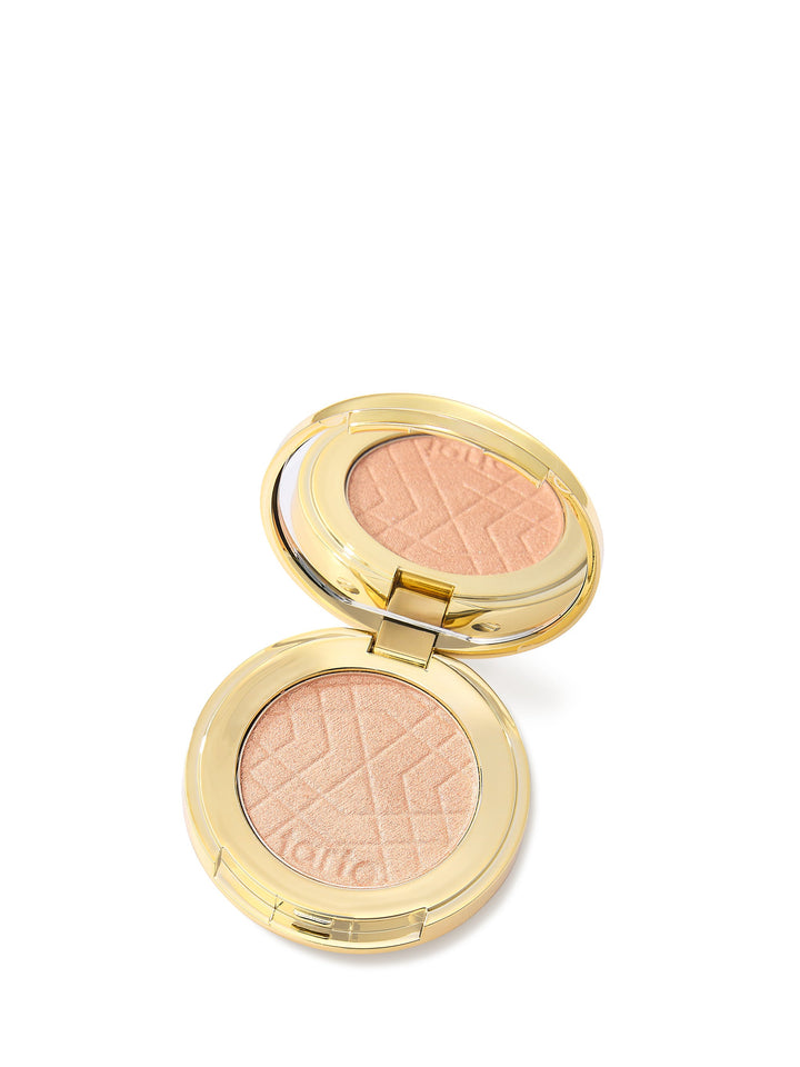 Compact blush with gold casing on a white background