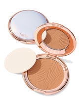 Compact powder with a zebra pattern and 'tarte' branding on a white background