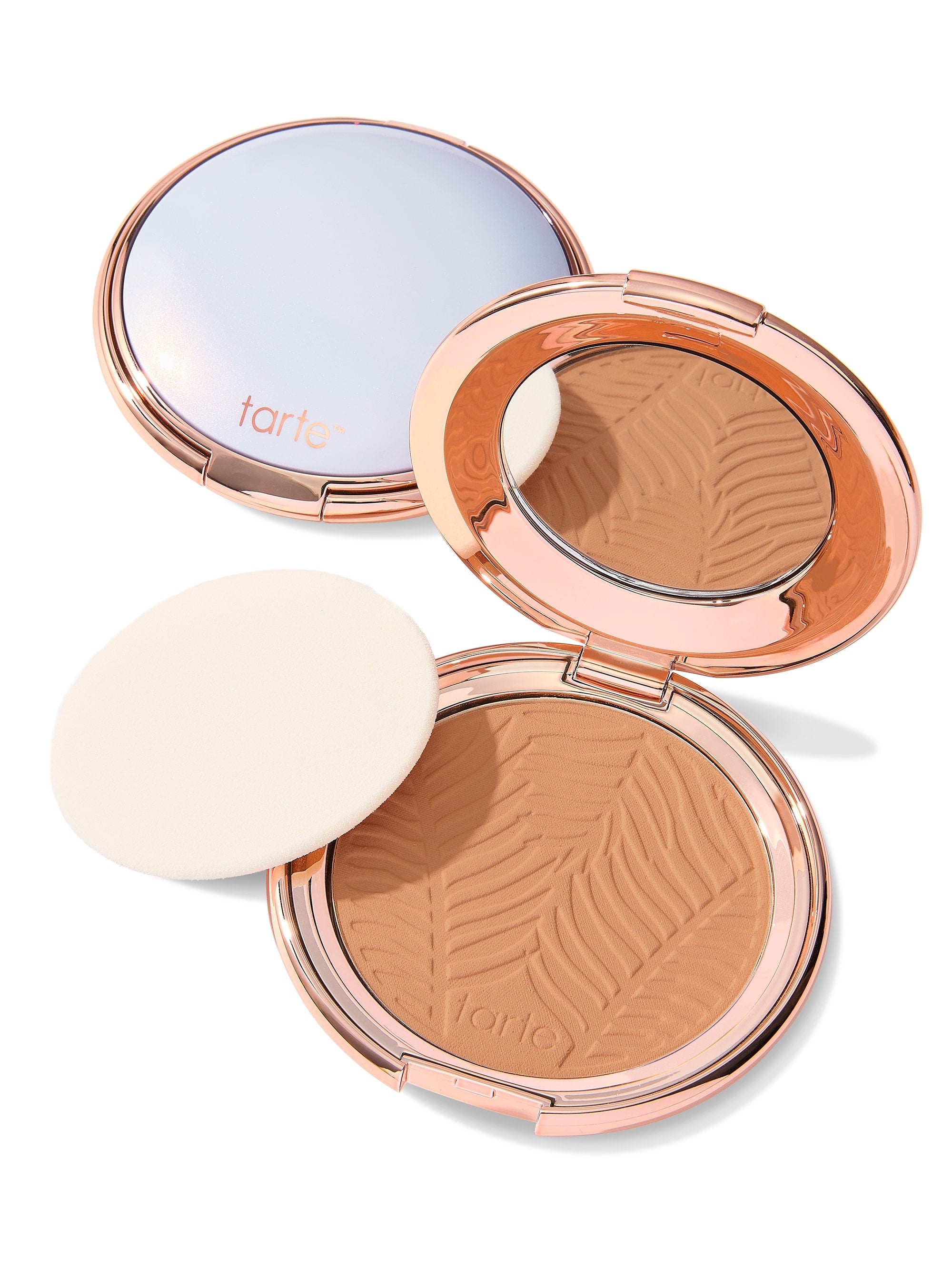 Compact powder with a zebra pattern and 'tarte' branding on a white background