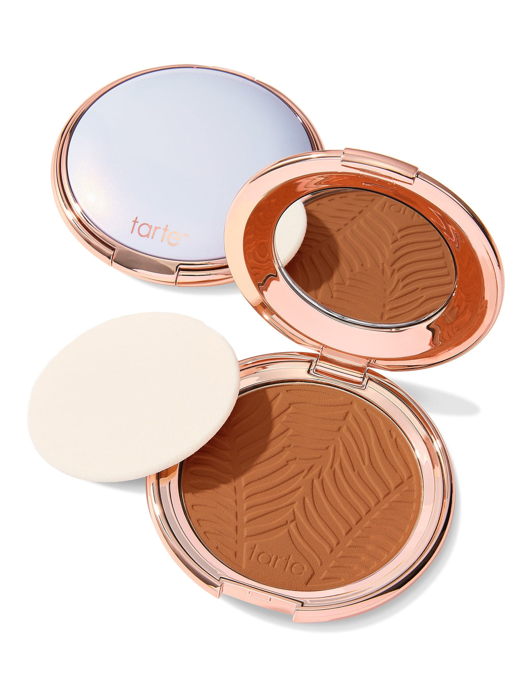 Compact powder with zebra pattern in a rose gold case on a white background