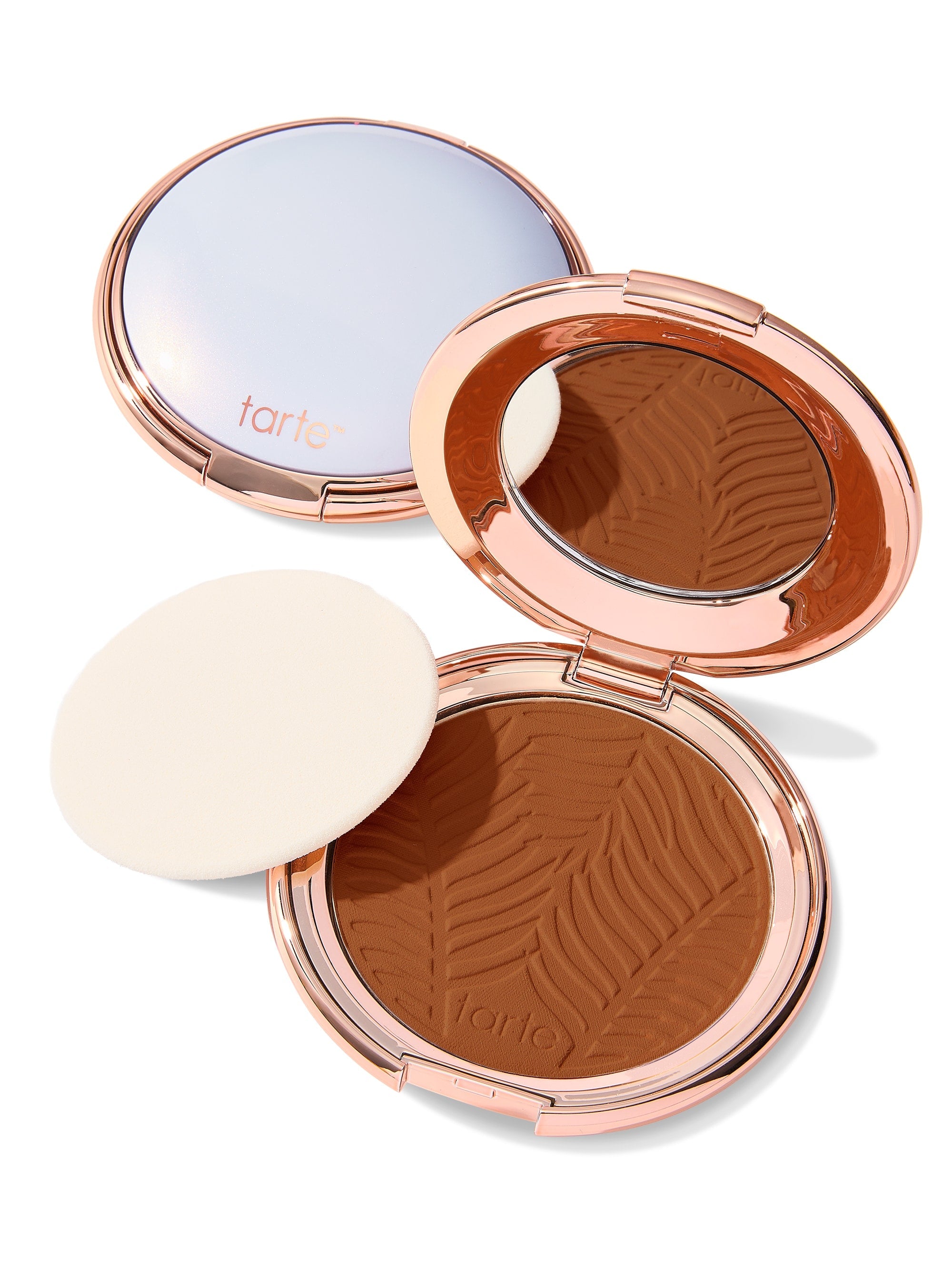 Compact powder with zebra pattern and 'tarte' branding on a white background