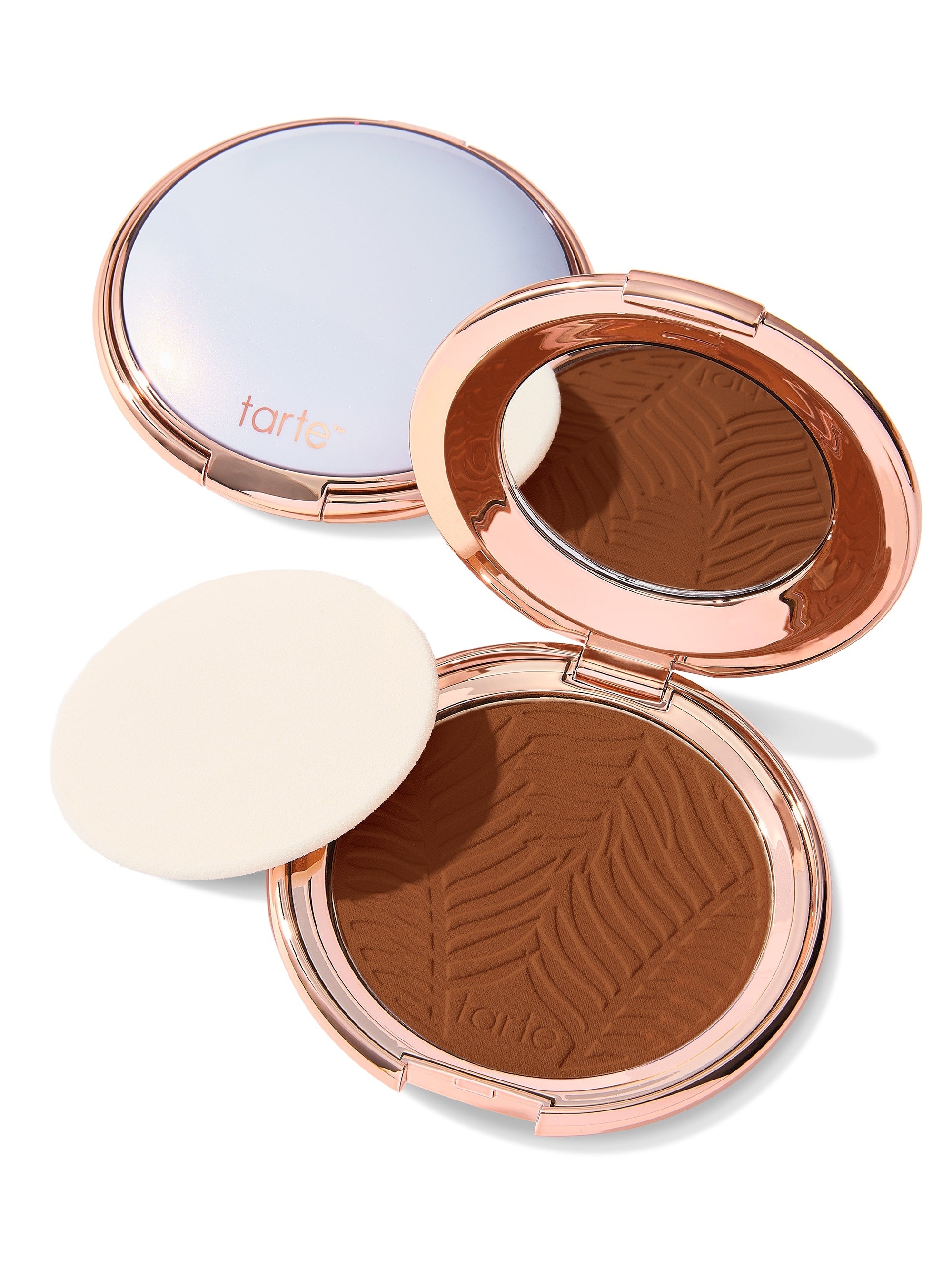 Compact powder with zebra pattern and 'tarte' branding on a white background