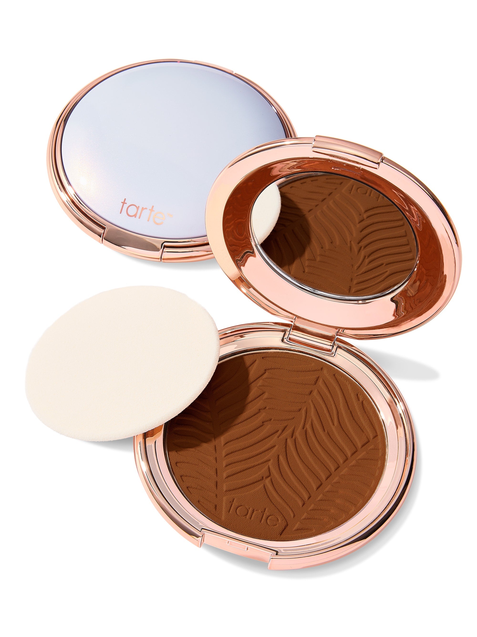 Compact powder with zebra pattern and 'tarte' branding on a white background