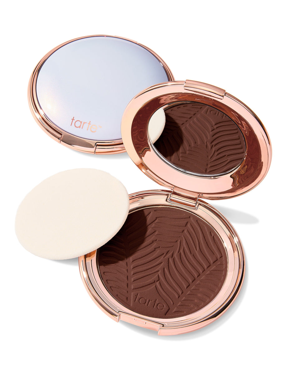 Compact powder with a zebra pattern in a rose gold case on a white background