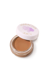 Open jar of brown cream with 'Maracuja' and 'Juicy' branding on a white background
