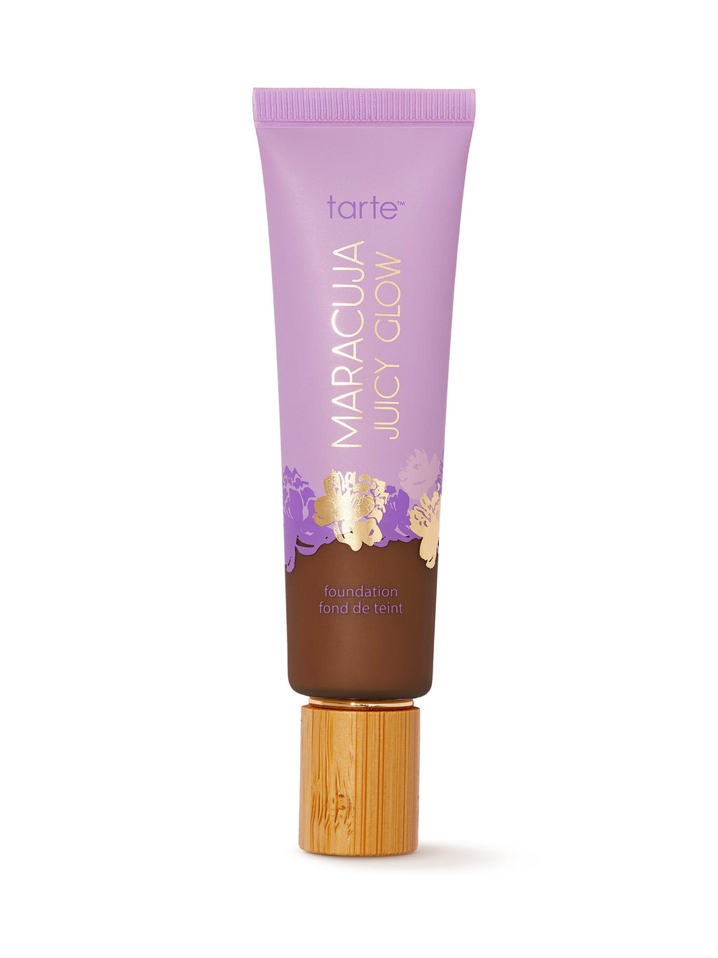 Tarte Maracuja Juicy Glow foundation tube with wooden applicator on a white background