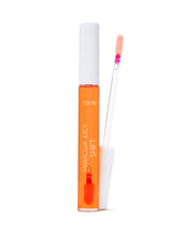 Orange lip gloss with applicator on a white background