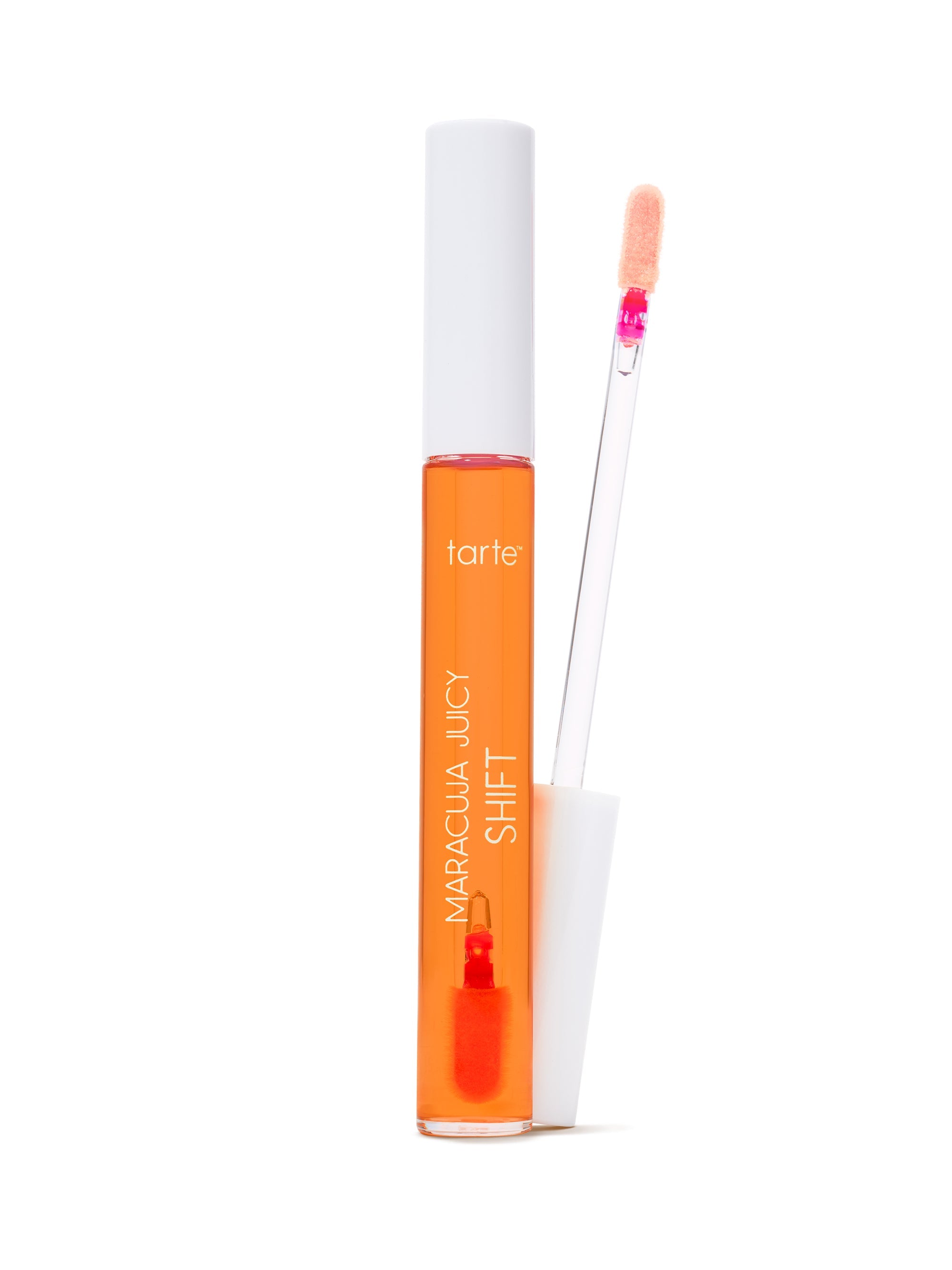 Orange lip gloss with applicator on a white background